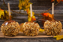 Caramel Apples On Wooden Background. Selective Focus.