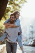 © Olena Bloshchynska - Young man giving girlfriend piggyback ride