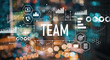 © Tierney - Team with blurred city abstract lights background