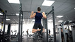 © motortion - Active man doing pull ups in gym, body workout program, strong muscles training