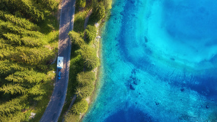 Wall Mural - aerial view at the road near lake. travelling on the car. landscape with transport from drone. view 
