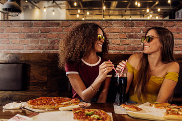 Wall Mural - Stylish friends having cold drink at cafe