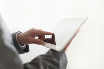 Wall Mural - close up.the businessman's hand presses on the screen of a digit