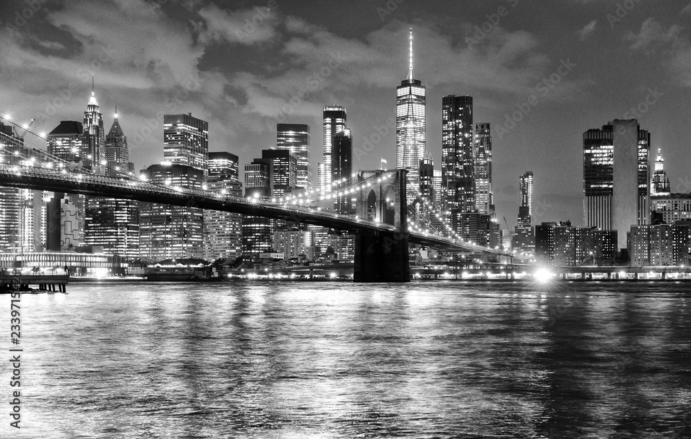New York City, financial district in lower Manhattan with Brooklin Bridge at night, USA - obrazy, fototapety, plakaty 