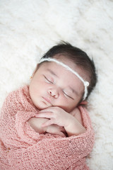 newborn sleeping above top view