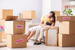 © Elnur - Young couple moving to new flat with fragile things