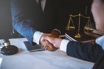 Lawyer business man shaking hands with clients, after finishing up a Consulting for insurance rent house. concept of home protection, family, insurance.