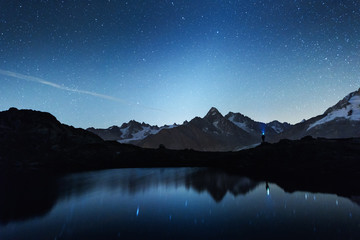 Wall Mural - picturesque night view of chesery lake (lac de cheserys) in france alps. monte bianco mountain range