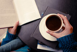 Fototapeta  - A girl with coffee and a book