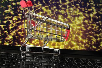 shopping cart and laptop