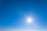 Fototapeta Na sufit - sparkle sun on a blue sky, natural background