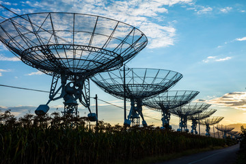 The silhouette of a radio telescope