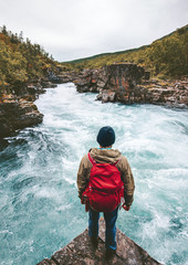man traveling with backpack enjoying view alone active lifestyle hiking at river canyon adventure va