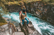 © EVERST - Adventurer man hiking alone active lifestyle extreme vacations outdoor on cliff above river canyon in Sweden