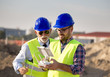 © Budimir Jevtic - Construction engineers with drone at building site