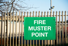 Fire Muster Assembly Point Sign At Workplace Car Park Fence