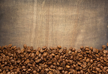 Sticker - coffee beans on wooden background