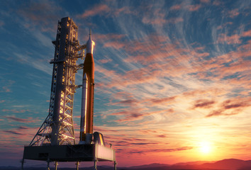 Wall Mural - space launch system on launchpad over background of sunrise