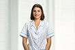 © DenisProduction.com - Portrait of young smiling nurse. Happy cheerful pharmacist in lab coat looking at camera. People, medicine, professions.