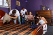Young adults in escape room with antique furnitures