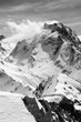 Black and white winter mountain with snow cornice