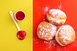 Tasty sweet sugary donuts with raspberry jam
