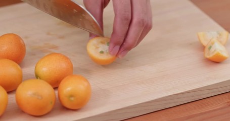 Poster - Cut of kumquat by knife