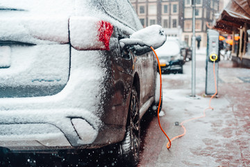 Electric car plug charging in the winter