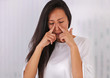 Woman suffering from sinusitis or Allergic rhinitis