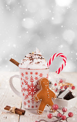 Christmas cup with hot chocolate and whipped cream.