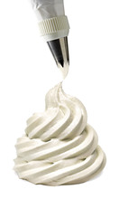 Whipped And Swirl Formed Vanilla Cream With Icing Bag Isolated On White Background