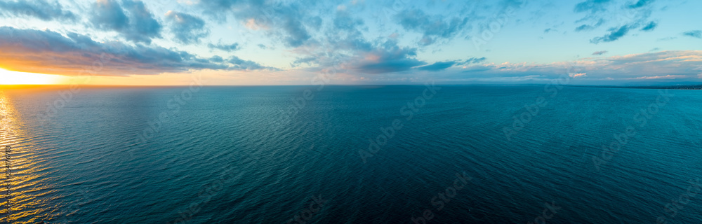 Wide aerial panorama of sunset over ocean - minimalistic seascape - obrazy, fototapety, plakaty 
