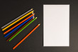 © Anton - Paper with pencils to write a letter or draw a picture on a dark background