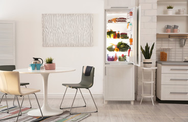 Sticker - Stylish kitchen interior with refrigerator full of products