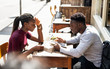 © Rawpixel.com - Couple reading the menu at a cafe