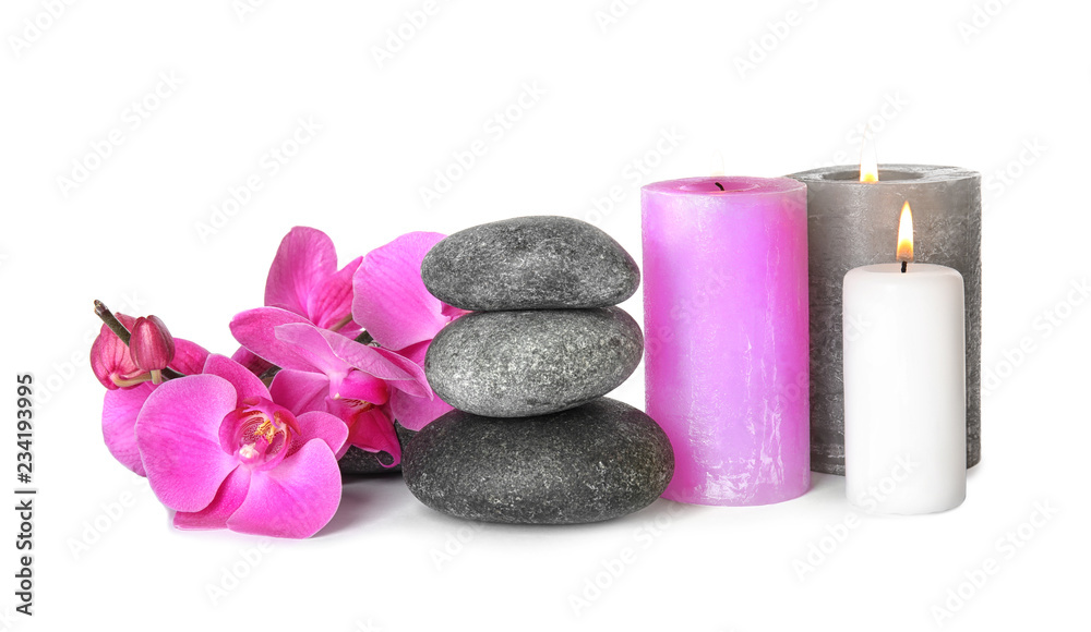 Composition with spa stones and candles on white background - obrazy, fototapety, plakaty 
