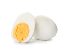 Sliced And Whole Hard Boiled Eggs On White Background
