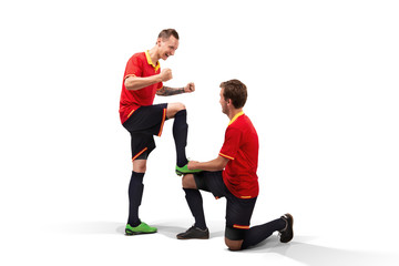 Wall Mural - two male soccer players celebrating victory isolated