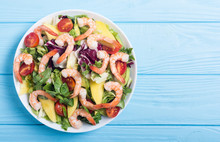 Mix Of Salad With Shrimps , Avocado And Cherry Tomatoes . Healthy Food Background
