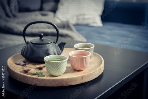Fotografía Black iron asian tea set on wooden tray