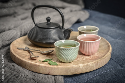 Fotografía Black iron asian tea set on wooden tray
