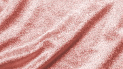 Rose gold pink velvet background or velour flannel texture made of cotton or wool with soft fluffy velvety satin fabric cloth metallic color material