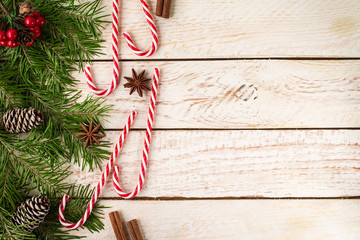     Frame made of festive Christmas decor on wooden background