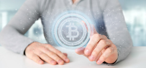 Poster - Man holding a technology Bitcoin icon on a circle 3d rendering