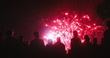 © NDABCREATIVITY - Crowd watching fireworks and celebrating new year eve
