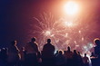 © NDABCREATIVITY - Crowd watching fireworks and celebrating new year eve