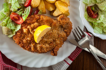 Sticker - Breaded viennese schnitzel with baked potatoes