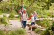 © Monkey Business - Family Hiking Along Path By River In UK Lake District