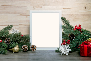 christmas holiday greeting frame design mockup with decoration on wood table.