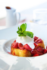 Wall Mural - French toast grilled with strawberries and ice cream on top